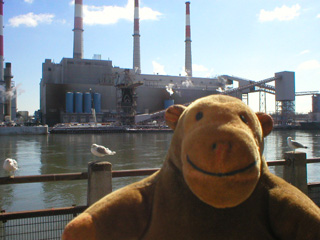 Mr Monkey looking at a factory in Queens
