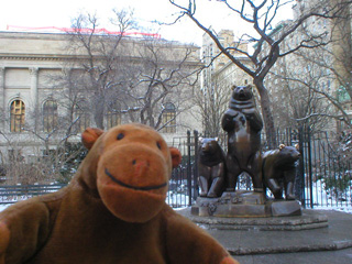 Mr Monkey in front three bronze bears