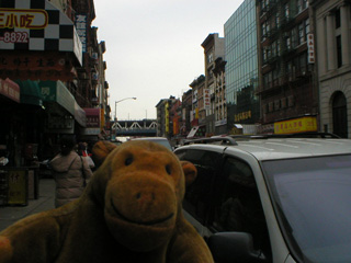Mr Monkey walking down East Broadway