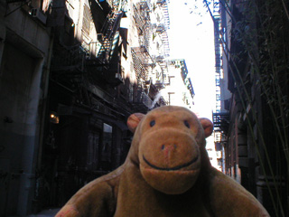 Mr Monkey walking down Cortland Alley