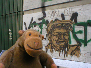 Mr Monkey in front of a head by Swoon