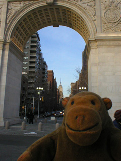 Mr Monkey looking down Fifth Avenue through the Washington Arch