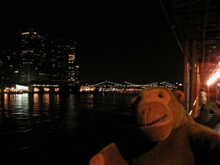 Mr Monkey looking back at Manhattan and the Brooklyn Bridge