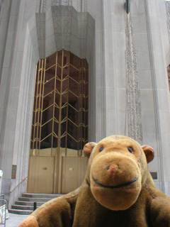Mr Monkey in front of the door of the Bank of New York
