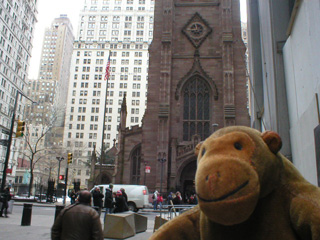 Mr Monkey looking across Broadway at Trinity Church