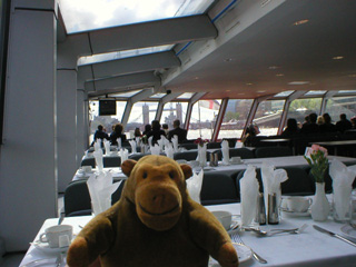 Mr Monkey looking at the inside of the cruise boat