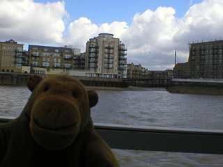 Mr Monkey passing the entrance to Limehouse docks