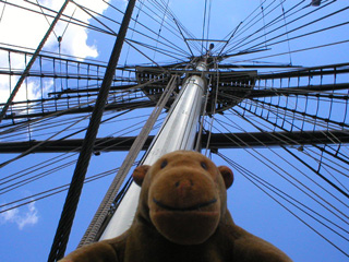 Mr Monkey looking up at one of the Cutty Sark's masts