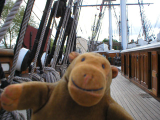 Mr Monkey checking the rigging along the starboard rail