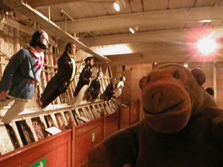 Mr Monkey looking at some figureheads