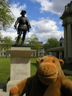 Mr Monkey with a statue of Sir Walter Raleigh