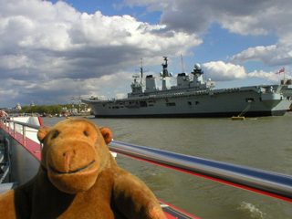 Mr Monkey passing an aircraft carrier