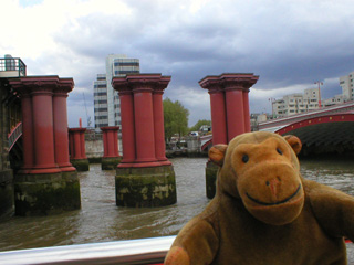 Mr Monkey passing the stumps of the old Blackfriars railway bridge
