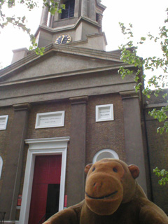 Mr Monkey looking up at St Paul's Church