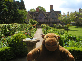Mr Monkey beside the sundial in the garden of Hall's Croft