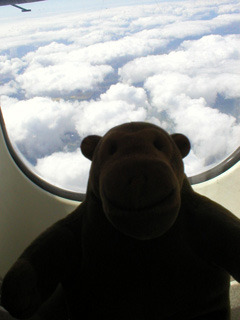 Mr Monkey looking down a clouds over England