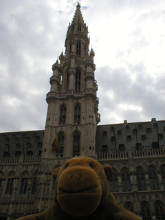 Mr Monkey looking up at the spire of the Hotel de Ville