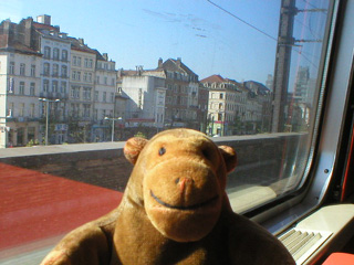 Mr Monkey in the train going though Brussels