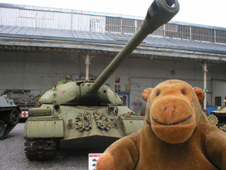 Mr Monkey in front of a Russian Stalin tank
