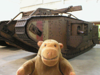 Mr Monkey looking at British Mark IV tank