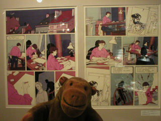 Mr Monkey with a display about colouring a comic strip