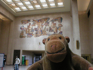 Mr Monkey looking at St Micheal in the Gare Centrale