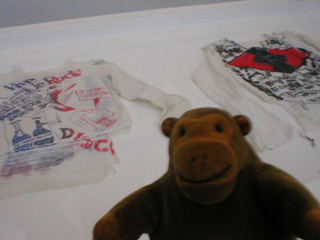 Mr Monkey looking at muslin shirts
