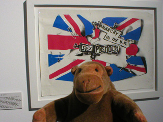 Mr Monkey with a printed Anarchy in the UK flag