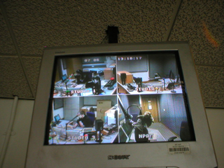 A monitor showing four radio studios