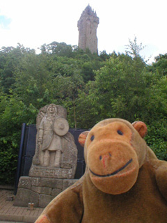 Mr Monkey looking up at the Monument from the car park