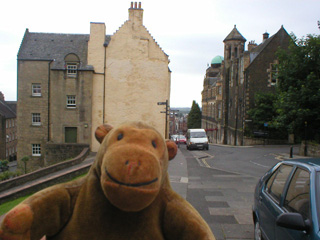 Mr Monkey looking down the street from the castle