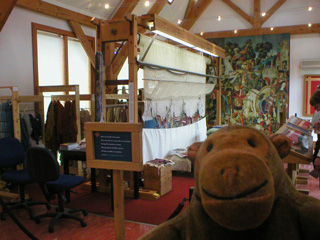 Mr Monkey looking at the tapestry in progress