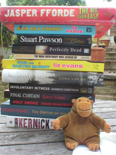 Mr Monkey with the books he bought