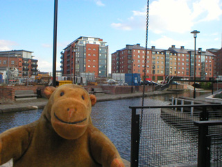 Mr Monkey crossing the bridge at the end of Jackson's Wharf