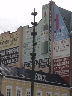 Painted advertisments on the side of the Lion Pharmacy