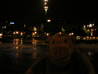 Mr Monkey crossing Stortorget in the night