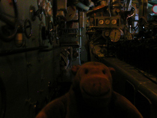 Mr Monkey looking at the diesel engine of the U3