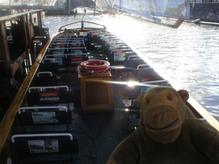 Mr Monkey looking into an empty tour boat