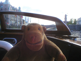 Mr Monkey sitting at the front of the boat