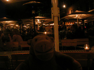 Mr Monkey under the umbrellas of Mondo Piccolo at night