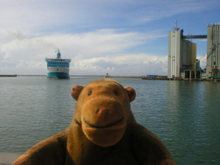 Mr Monkey watching a ferry sail into Ystad harbour
