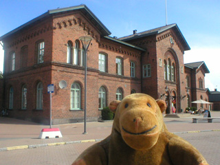 Mr Monkey looking at the railway station from the dock