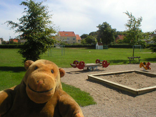 Mr Monkey in a children's playground