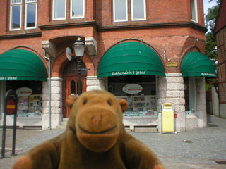 Mr Monkey outside a bookshop