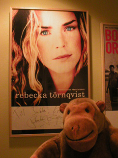 Mr Monkey looking at a signed Rebecka Tornqvist poster