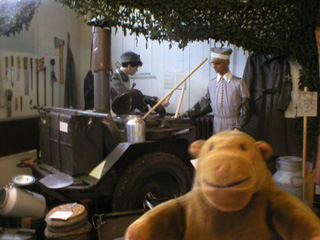 Mr Monkey looking at a recreated field kitchen