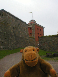 Mr Monkey looking back at the tower of the fortress
