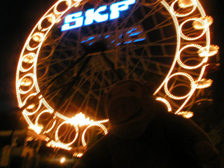 Mr Monkey looking at the Ferris Wheel from a distance