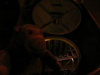 Mr Monkey preparing to go through a circular hatch in the floor