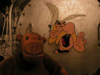 Mr Monkey looking at Asterix on a boiler